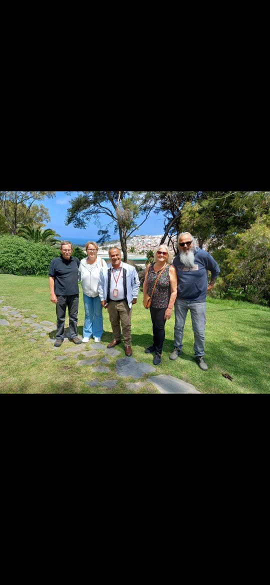 Happy tourists with Abdul in Tangier scenic park