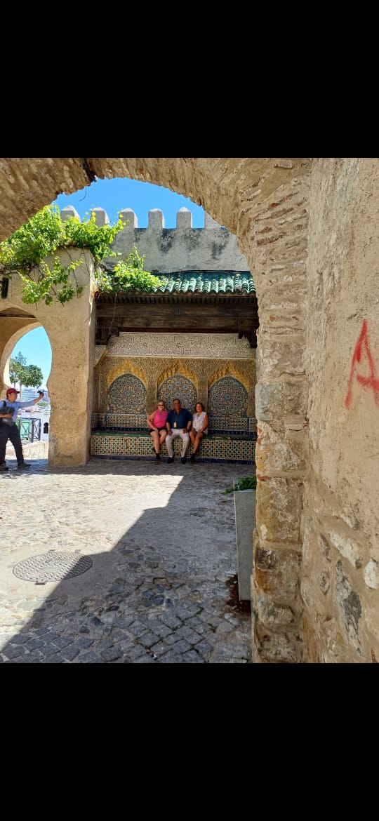 Tourists exploring traditional Kasbah courtyard